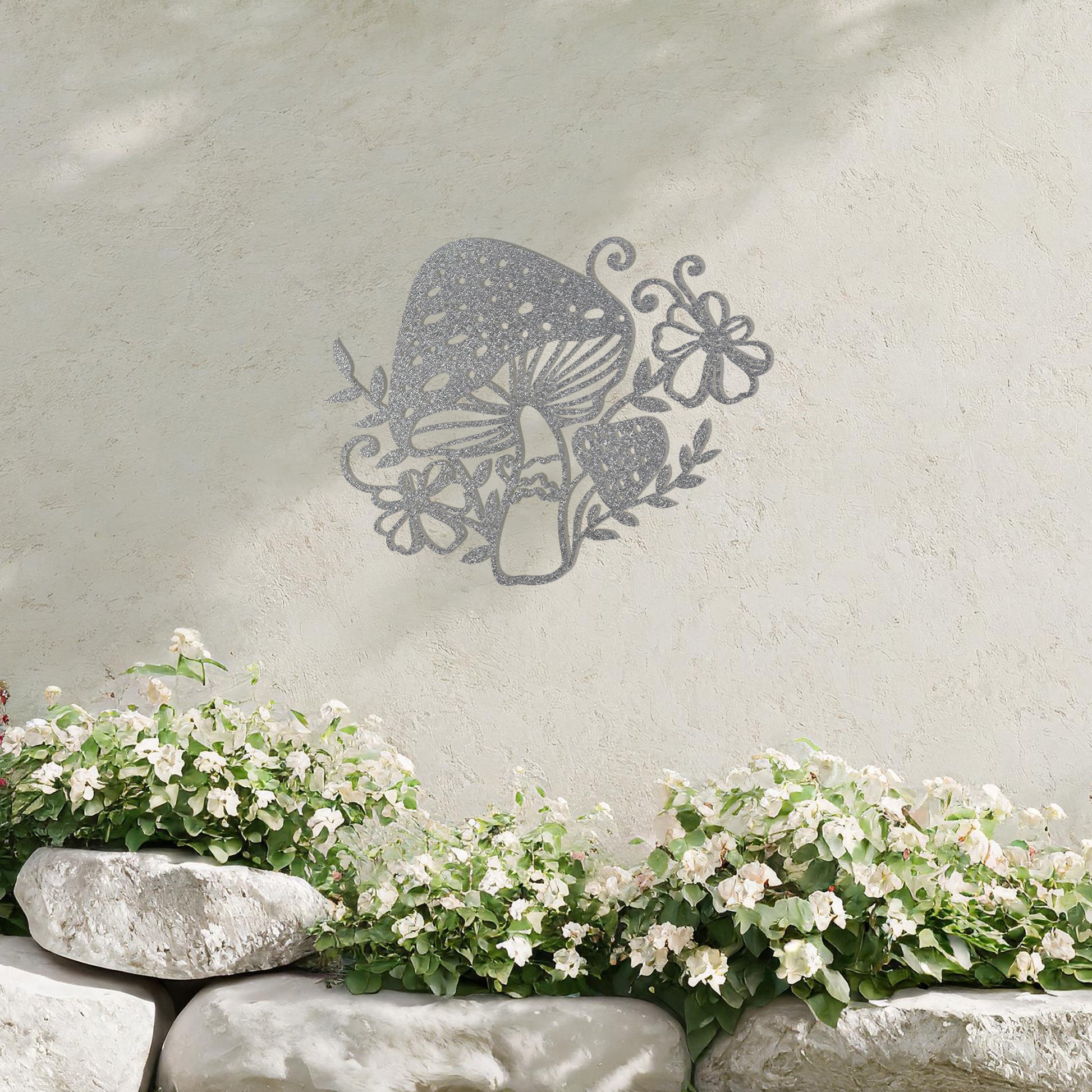 Metal garden decoration featuring a whimsical mushroom design surrounded by floral and leafy accents, intricately crafted to bring a touch of nature-inspired charm and artistry to outdoor spaces