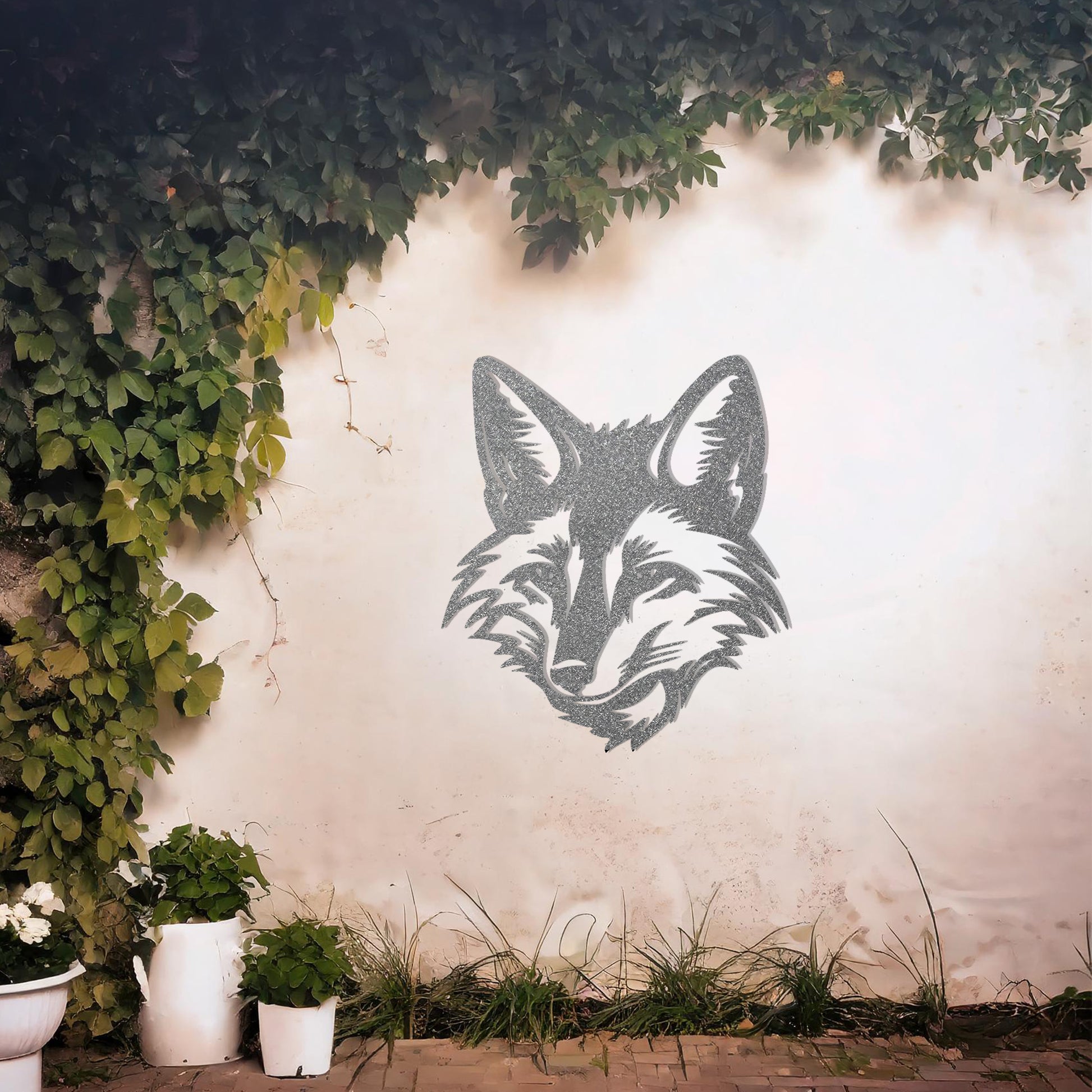 This is a sleek and artistic metal wall art design showcasing the face of a fox, intricately crafted to highlight its cunning expression and sharp features. Perfect for adding a stylish, nature-inspired element to your space.