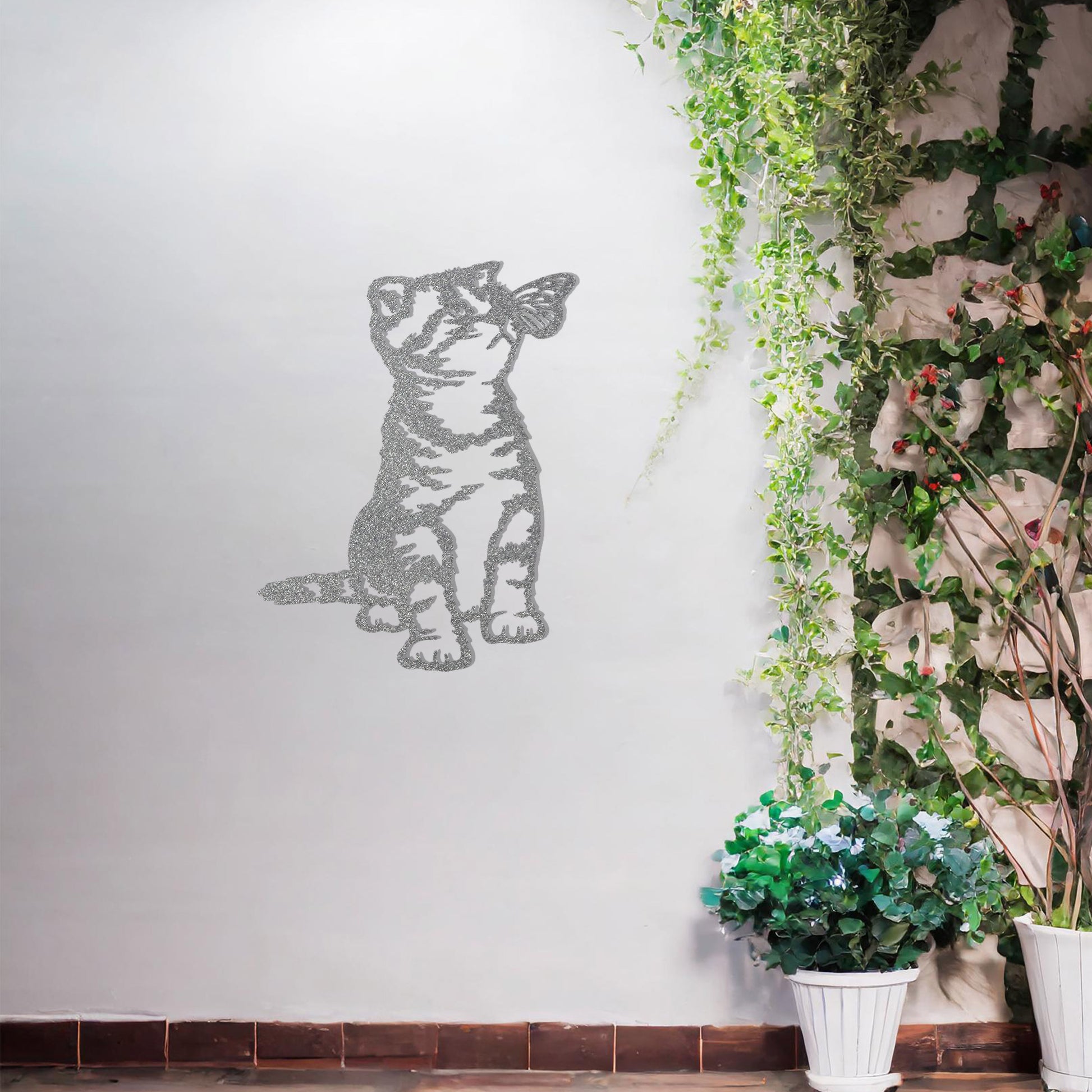 This image shows a playful and endearing design of a kitten interacting with a butterfly. The cat, in a curious and playful pose, captures the essence of feline innocence and charm. It’s a delightful piece of wall art that would add a whimsical touch to any space.