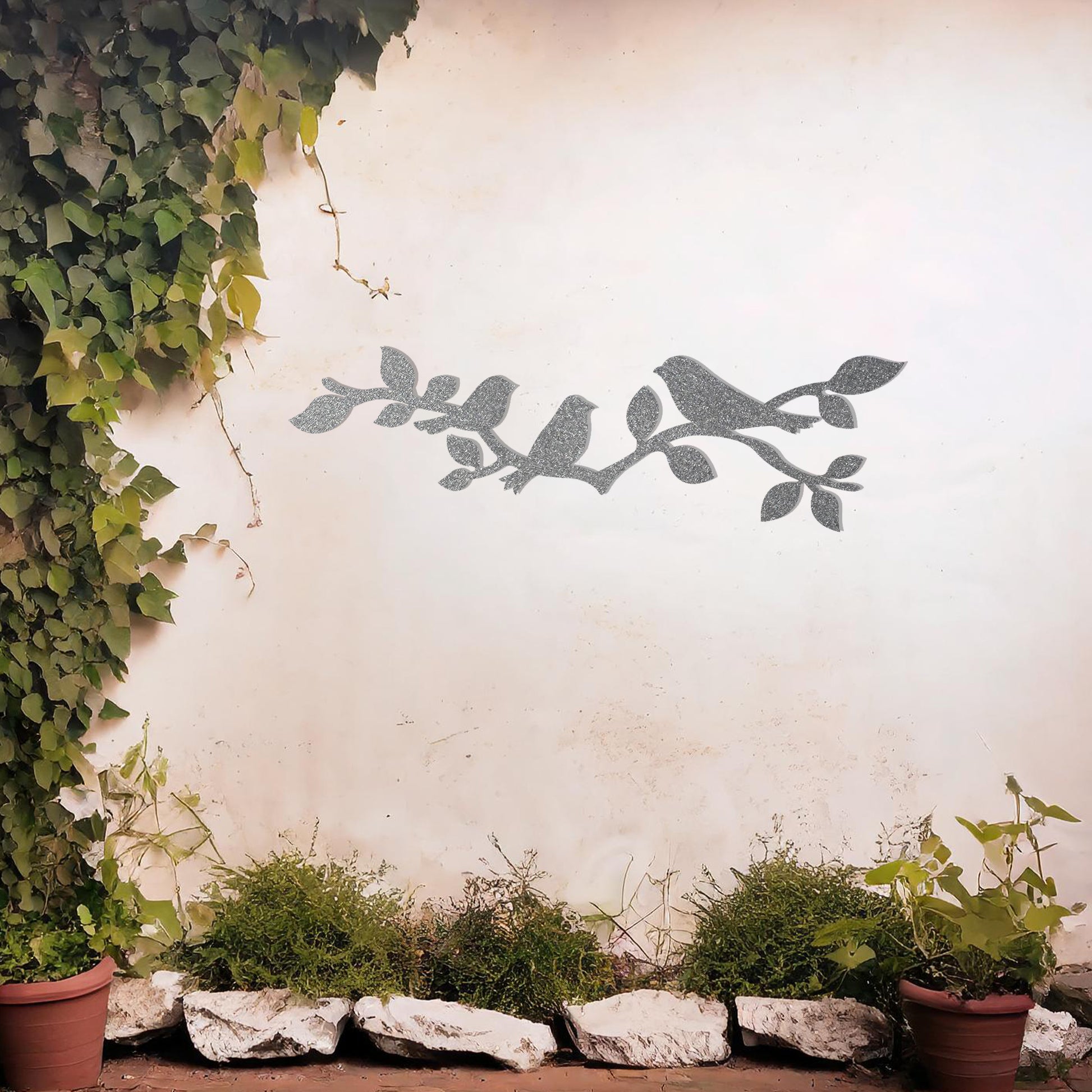 This design features a group of birds perched gracefully on a leafy branch, creating a serene and natural aesthetic. The intricate silhouettes of the birds and leaves make this artwork ideal for adding a touch of nature-inspired elegance to any wall.