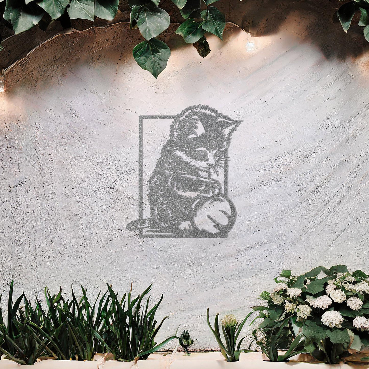This is a cute metal wall art design featuring a playful kitten sitting and playing with a ball. The design captures the cat's natural curiosity and playful spirit, making it a perfect addition for cat lovers or for adding a touch of whimsy to a space