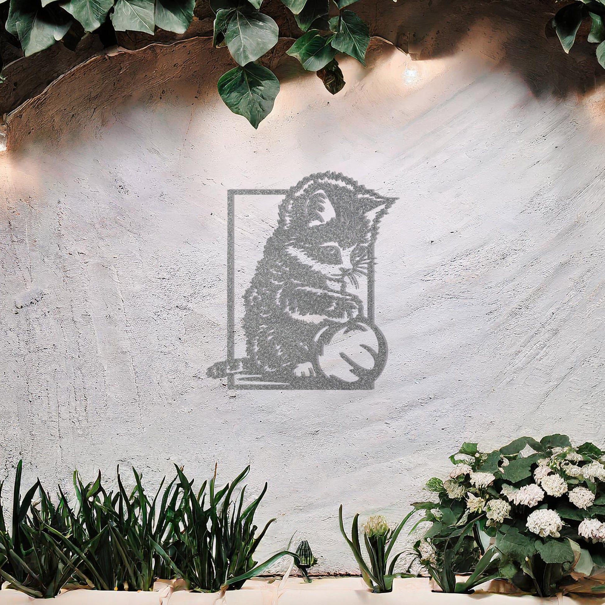 This is a cute metal wall art design featuring a playful kitten sitting and playing with a ball. The design captures the cat's natural curiosity and playful spirit, making it a perfect addition for cat lovers or for adding a touch of whimsy to a space