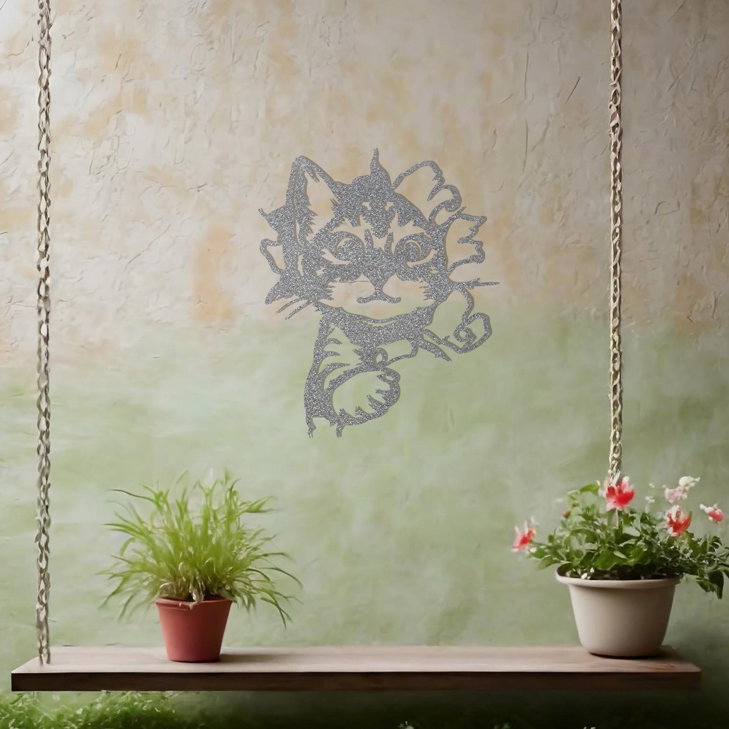 This image showcases a charming metal wall art design of a kitten peeking out from a tear in the wall. The cat's playful and curious expression adds a sense of warmth and whimsy, making it a delightful addition to any space, especially for animal lovers.