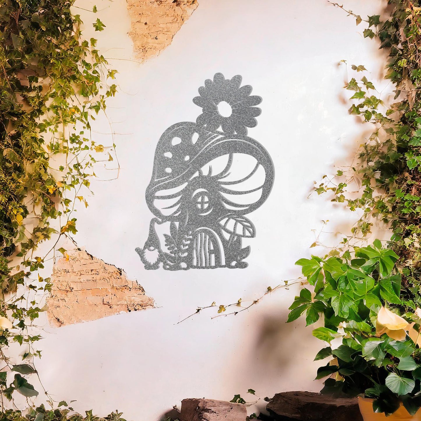 Metal garden decoration featuring a whimsical mushroom house adorned with floral and foliage details, crafted with intricate patterns, adding an enchanting and playful touch to outdoor or indoor spaces.