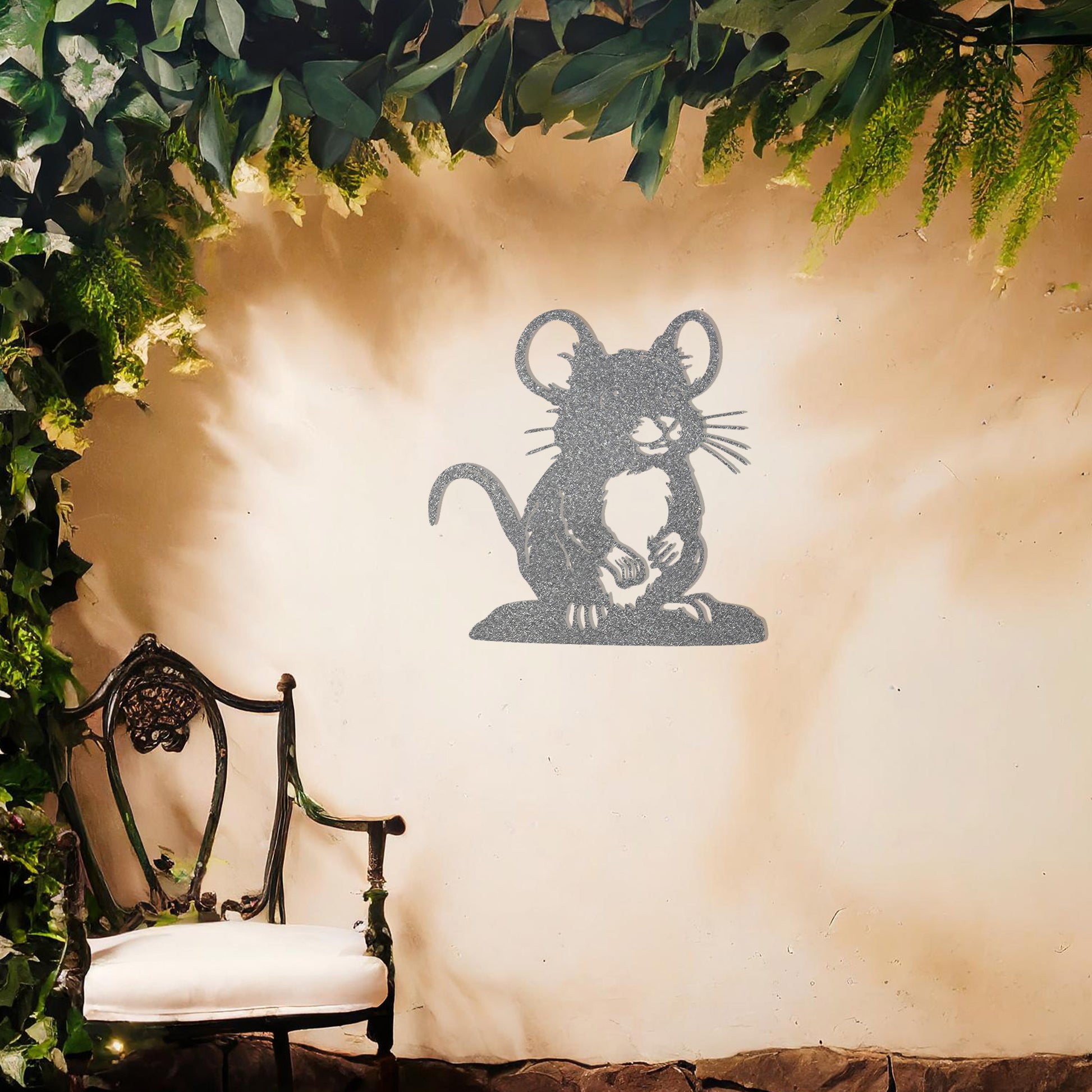 A delightful metal wall art piece featuring a whimsical mouse perched on a platform, adding a playful charm to a neutral wall. Perfect for modern garden decor, this design blends seamlessly with lush greenery and an outdoor water feature.