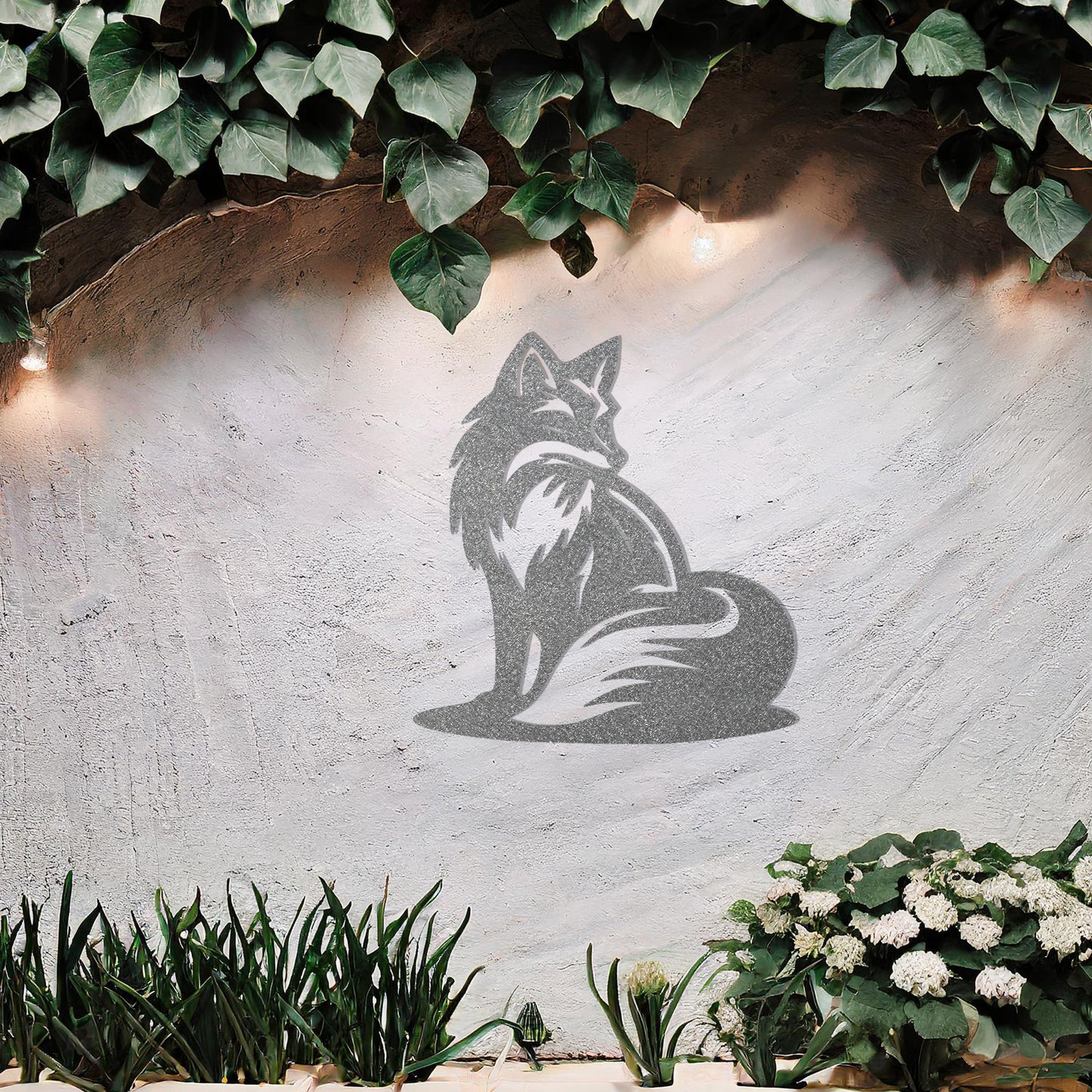 This metal wall art design depicts a sitting fox, elegantly turned to the side, showcasing its bushy tail and graceful silhouette. The minimalist yet detailed cutout enhances the fox's serene and poised demeanor, adding a touch of sophistication to any space.