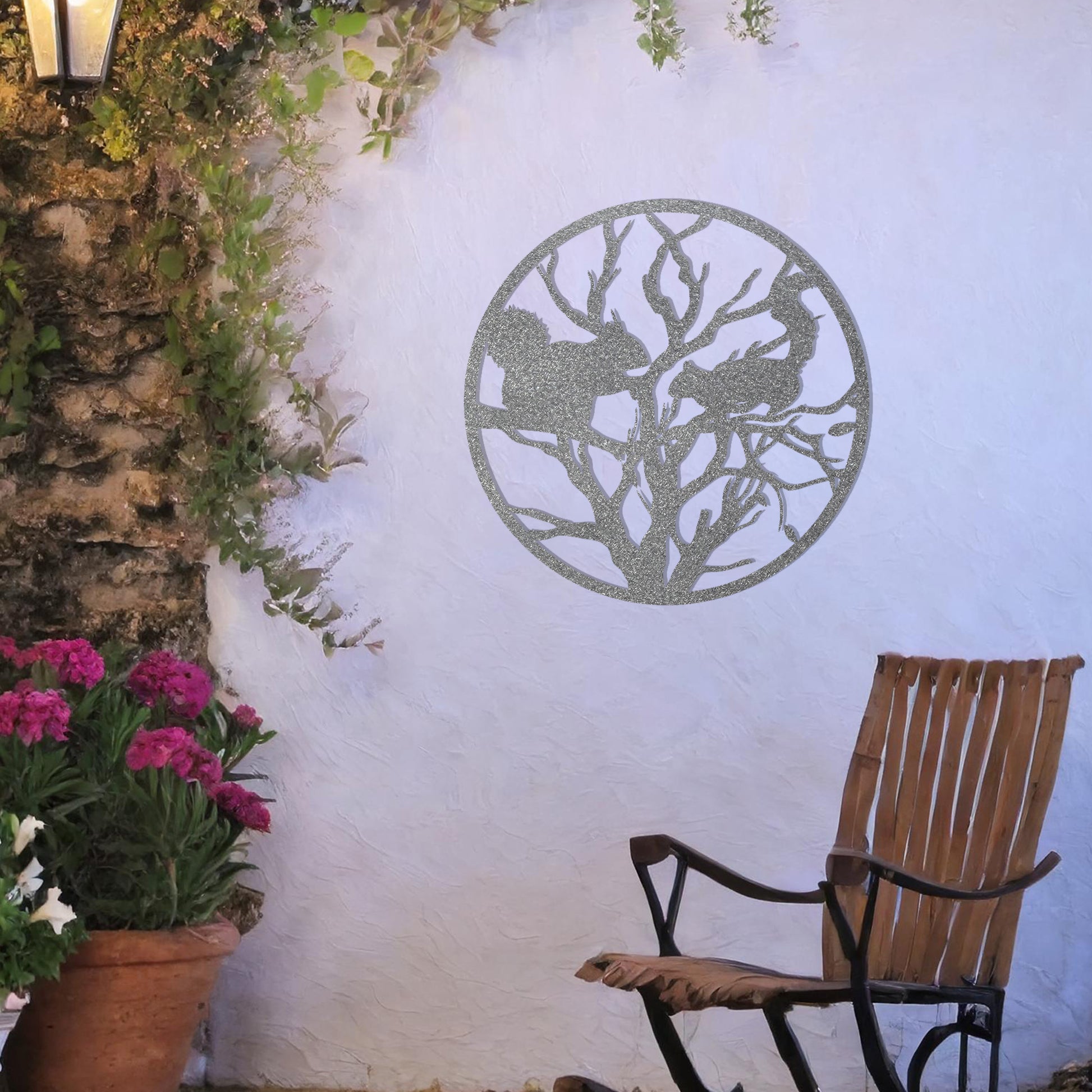 This circular design depicts a detailed silhouette of two squirrels interacting on tree branches. The intricate pattern captures the natural essence of wildlife within the tree, creating a harmonious and visually striking piece for nature enthusiasts.