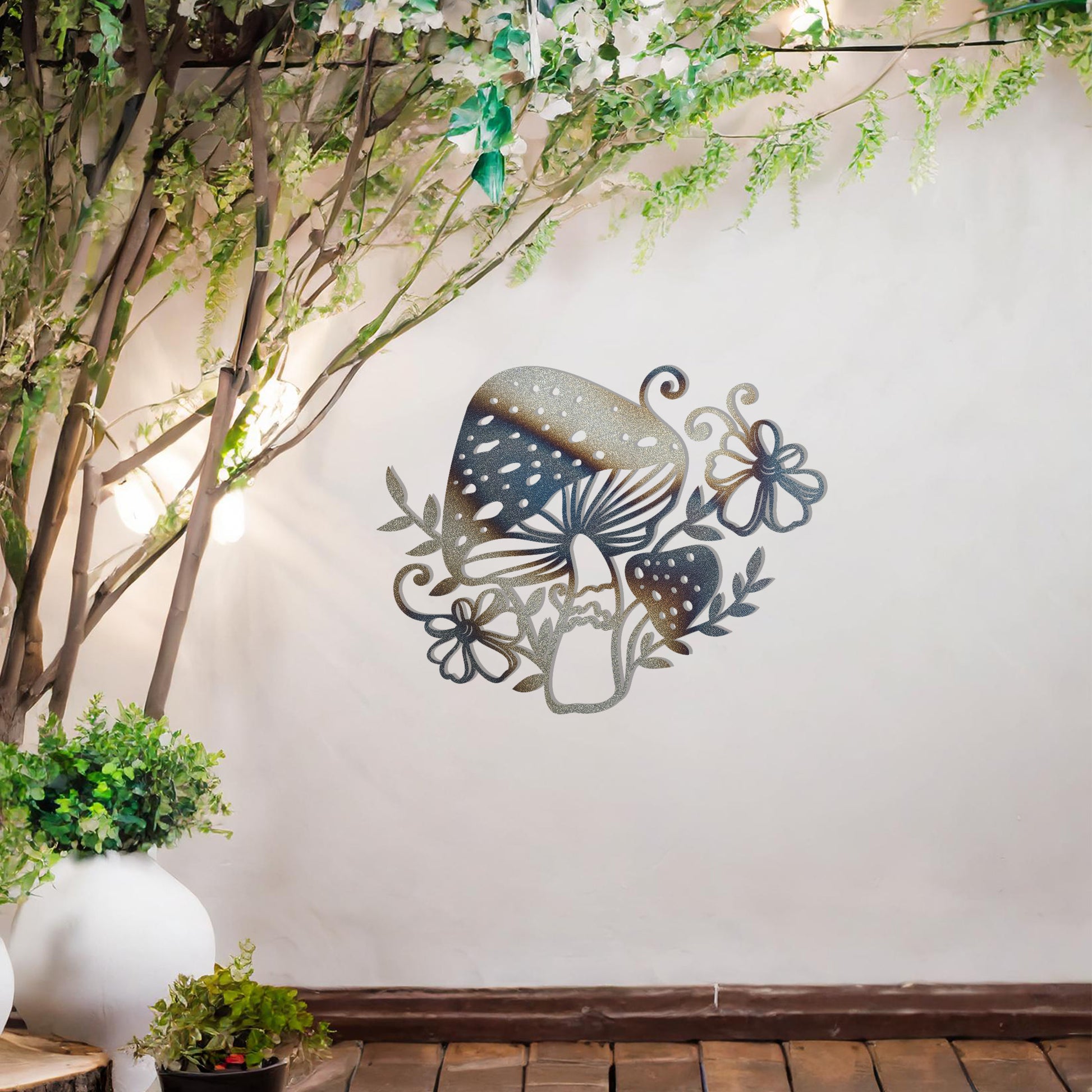 Metal garden decoration featuring a whimsical mushroom design surrounded by floral and leafy accents, intricately crafted to bring a touch of nature-inspired charm and artistry to outdoor spaces
