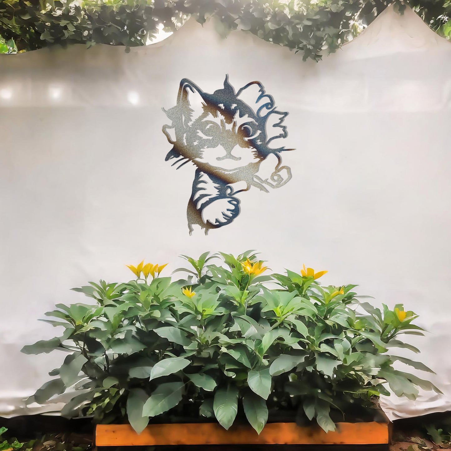 This image showcases a charming metal wall art design of a kitten peeking out from a tear in the wall. The cat's playful and curious expression adds a sense of warmth and whimsy, making it a delightful addition to any space, especially for animal lovers.