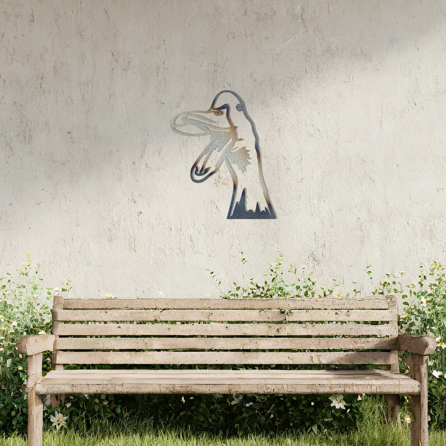A quirky metal wall art of a duck with an open beak, showcasing playful and artistic detail. This unique design adds a touch of humor and charm to any modern setting, surrounded by greenery and soft floral accents.