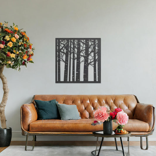 Wooden wall art featuring a square design with a forest motif of tall, slender trees and intricate branch details. The artwork is displayed on a neutral wall within modern room decor, creating a serene and nature-inspired aesthetic.