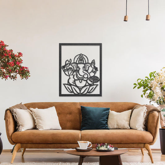 Wooden wall art featuring a framed design of Lord Ganesha sitting on a lotus flower with intricate details. The artwork is displayed on a neutral wall within modern room decor, highlighting its cultural and artistic elegance.