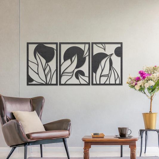 Wooden wall art design featuring a three-panel composition with abstract shapes and flowing leaves, placed on a neutral wall within modern room decor. The design blends geometric forms and natural elements for a contemporary aesthetic.