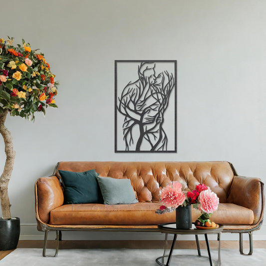 Wooden wall art featuring a rectangular design of two intertwined human figures stylised with tree branches, symbolising connection and unity. The artwork is displayed on a neutral wall within modern room decor, highlighting its artistic and emotional depth.