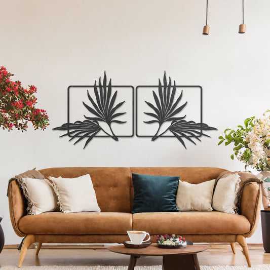 Wooden wall art featuring two symmetrical palm leaf designs within rectangular frames. The artwork is placed on a neutral wall in modern room decor, showcasing its elegant natural motif.