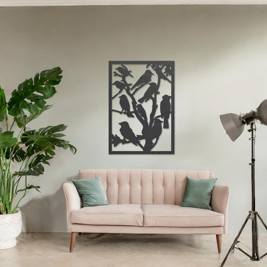 Wooden wall art featuring a detailed design of birds perched on branches. The artwork is displayed on a neutral wall within modern room decor, highlighting the intricate natural pattern.