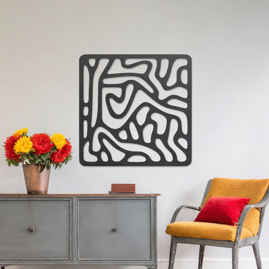 Wall art featuring an abstract design with flowing, interconnected organic shapes forming a bold pattern. The piece is displayed on a neutral wall within modern decor, adding a contemporary and artistic touch to the space.