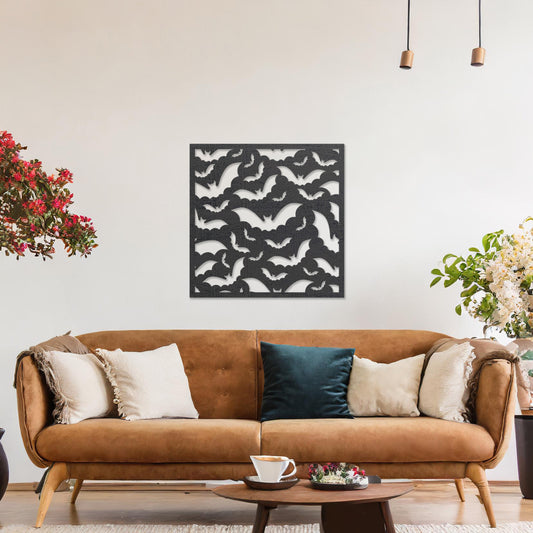 Wooden wall art featuring a square design with a dynamic pattern of flying bats. The artwork is displayed on a neutral wall within modern room decor, highlighting its bold and thematic appeal.