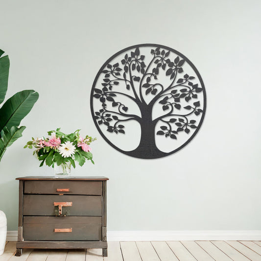 Wooden wall art featuring a circular tree design with detailed leaves and branches, displayed on a neutral wall within modern room decor, emphasising its natural elegance and intricate craftsmanship.