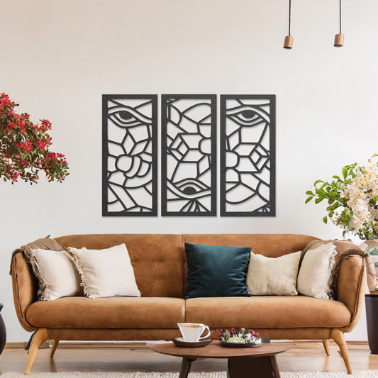 Wooden wall art featuring a three-panel abstract design with geometric shapes and eye motifs. The artwork is displayed on a neutral wall within modern room decor, showcasing its intricate and unique pattern.