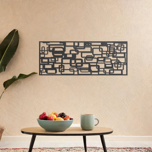 Wooden wall art design featuring an abstract pattern of overlapping and interwoven geometric shapes, placed on a neutral wall with modern room decor. The design combines clean lines and shapes for a dynamic and contemporary aesthetic.
