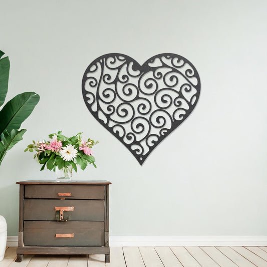 Wooden wall art featuring a heart-shaped design with intricate swirling patterns, displayed on a neutral wall within modern room decor, showcasing its elegant and artistic craftsmanship.