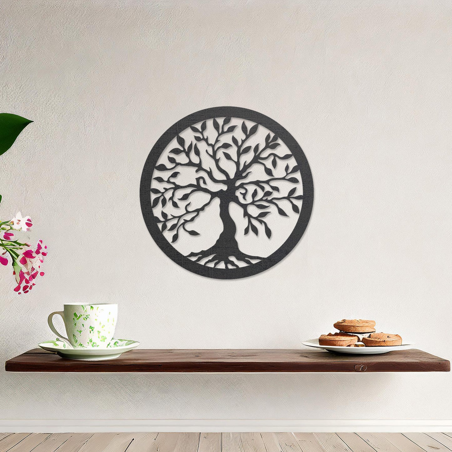 Round wooden wall art featuring an intricately designed tree with sprawling branches and delicate leaves, placed on a neutral wall within a modern setting. The art adds a natural and stylish focal point to the room.