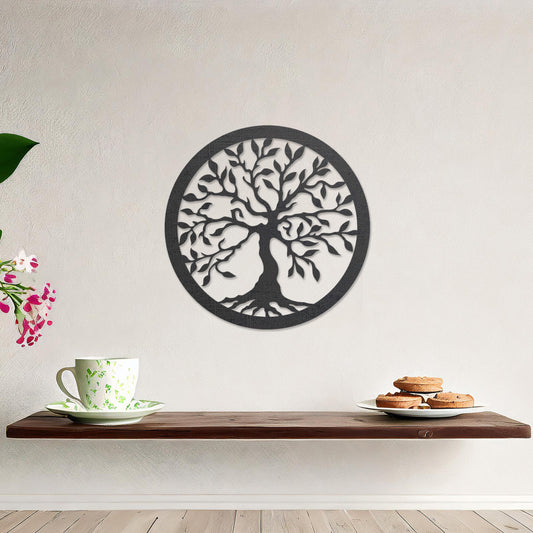 Round wooden wall art featuring an intricately designed tree with sprawling branches and delicate leaves, placed on a neutral wall within a modern setting. The art adds a natural and stylish focal point to the room.