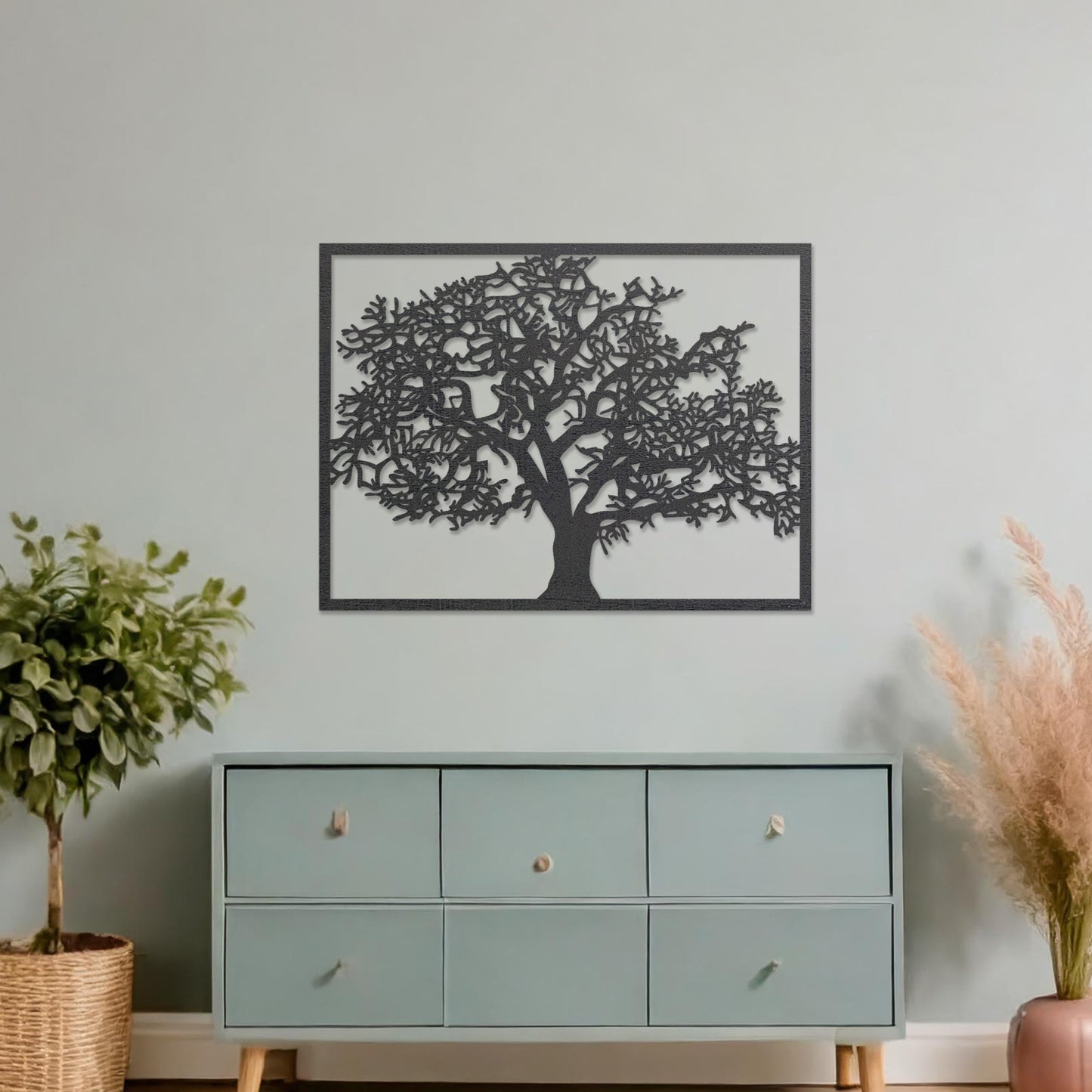 Wooden wall art featuring a rectangular tree design with detailed branches and leaves, displayed on a neutral wall within modern room decor, showcasing its natural and intricate craftsmanship.