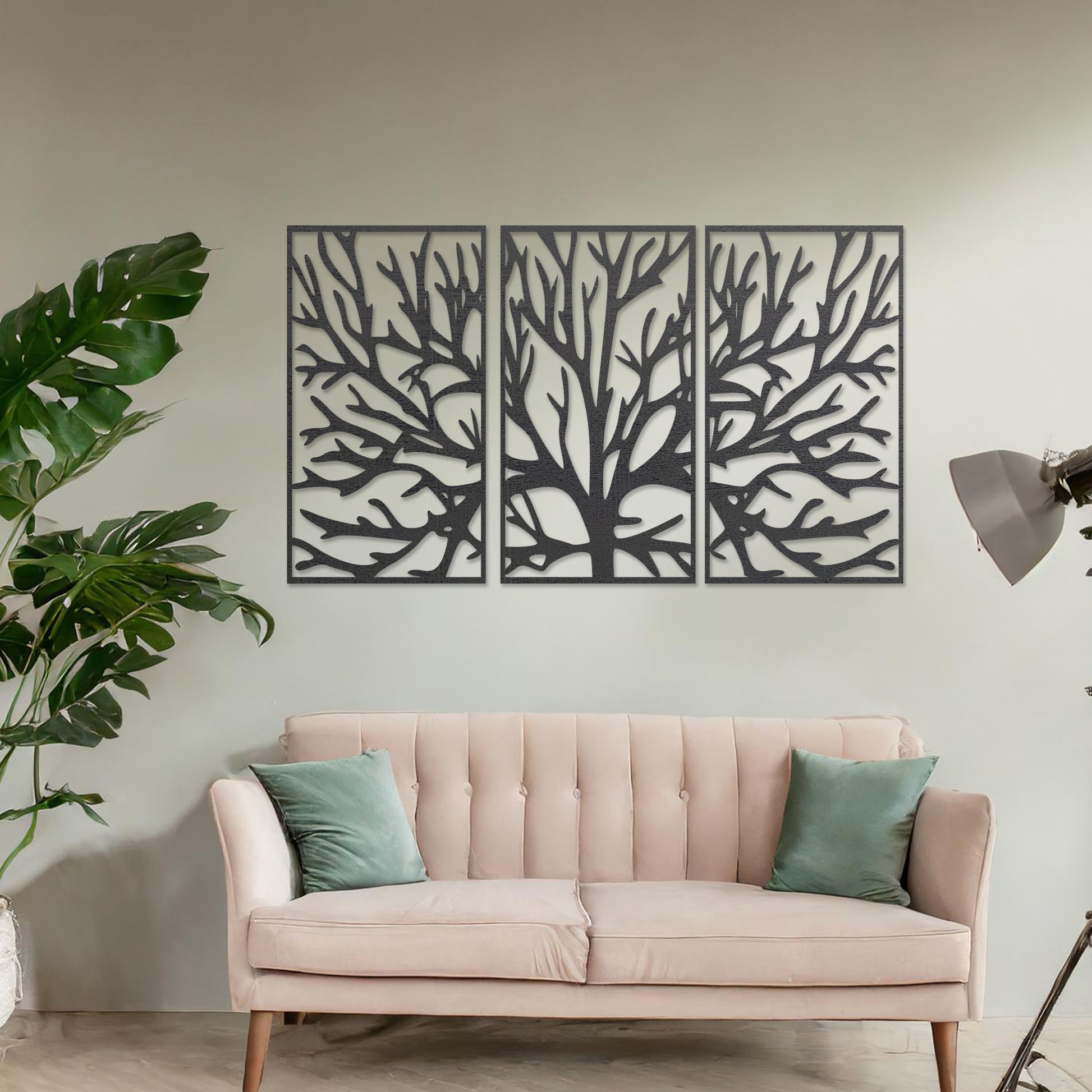 Wall art featuring an intricate tree branch design split into three panels. The piece is displayed on a neutral wall within modern room decor, complementing the surrounding contemporary setting.