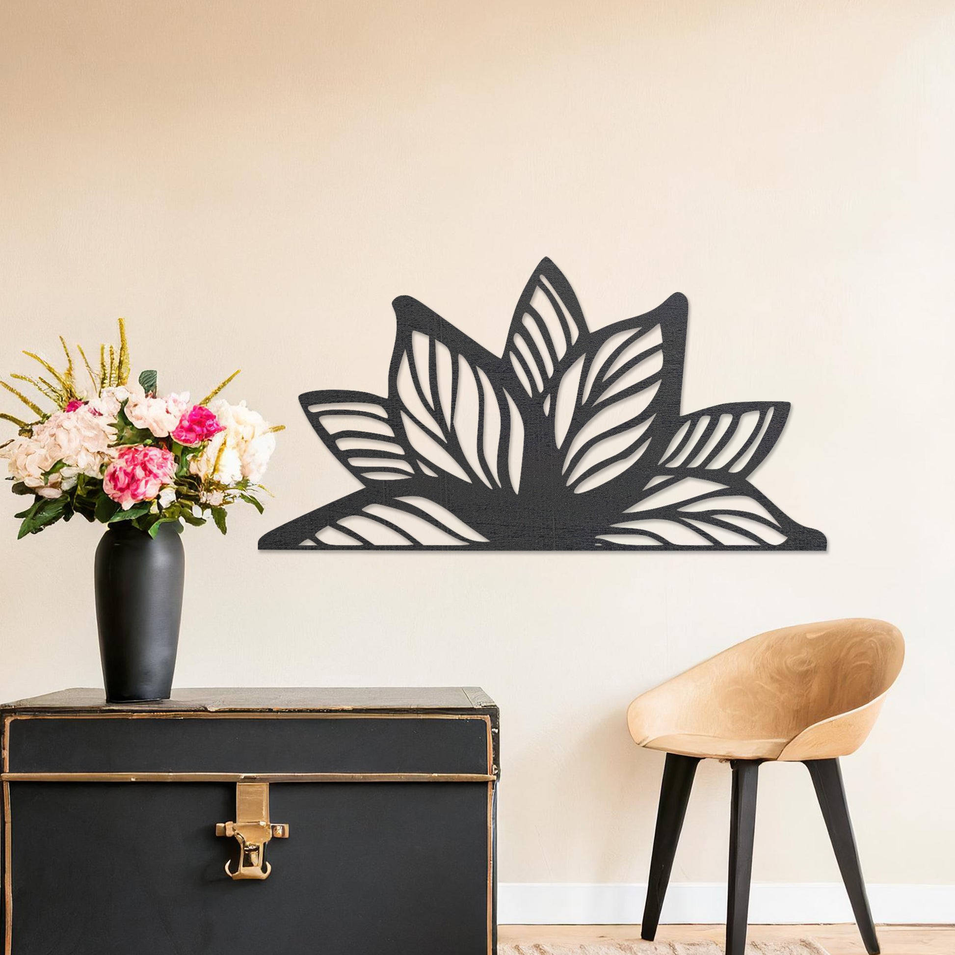 Wall art featuring a lotus-inspired design with layered leaves and intricate cut-out patterns. The piece is displayed on a neutral wall within modern decor, adding a natural and calming focal point to the space.