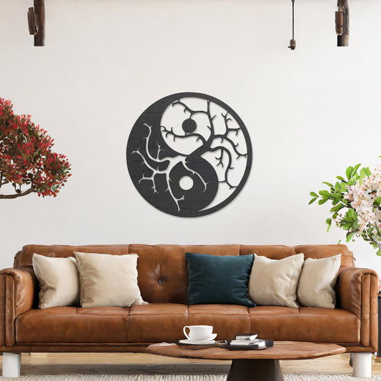Wall art featuring a yin-yang design with tree branches integrated into each half, symbolising balance and harmony. The piece is displayed on a neutral wall within modern decor, adding a meaningful and artistic focal point to the space.
