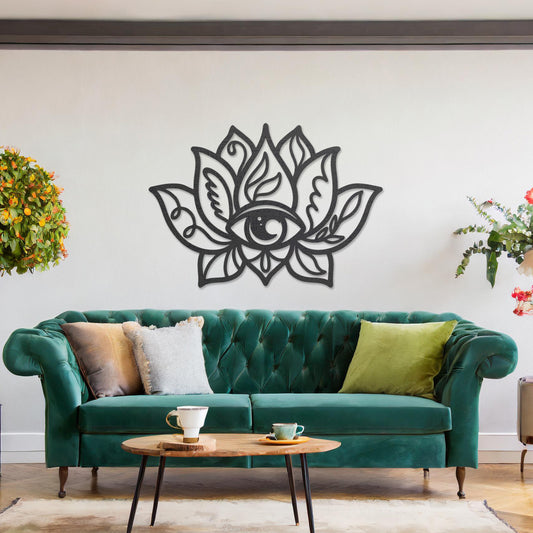 Wooden wall art featuring a lotus flower design with an eye motif at its centre and intricate detailing. The artwork is displayed on a neutral wall within modern room decor, highlighting its symbolic and artistic appeal.