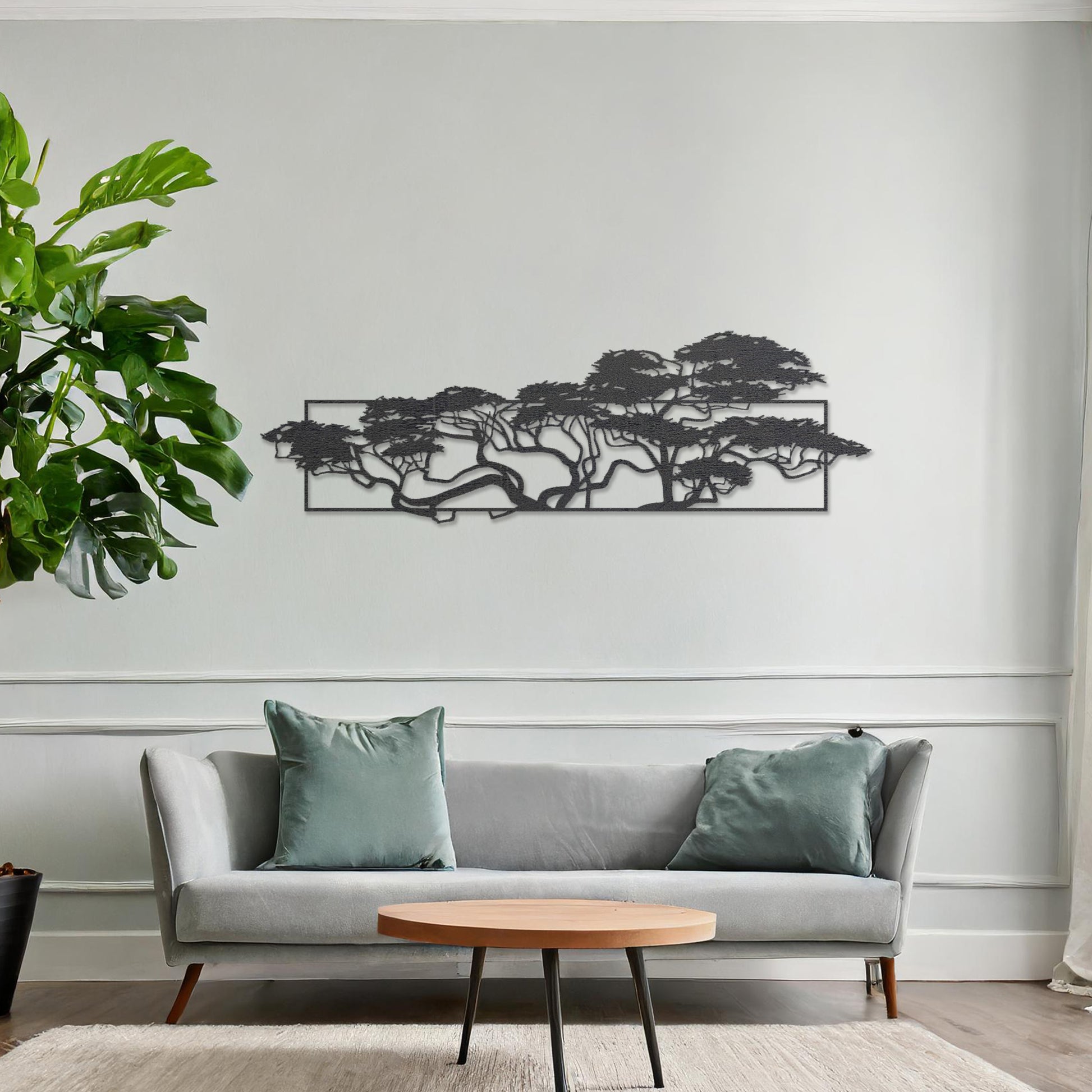 Wooden wall art featuring a panoramic design of windswept trees with intricate branches, displayed on a neutral wall within modern room decor, emphasising its natural elegance and artistic detail.