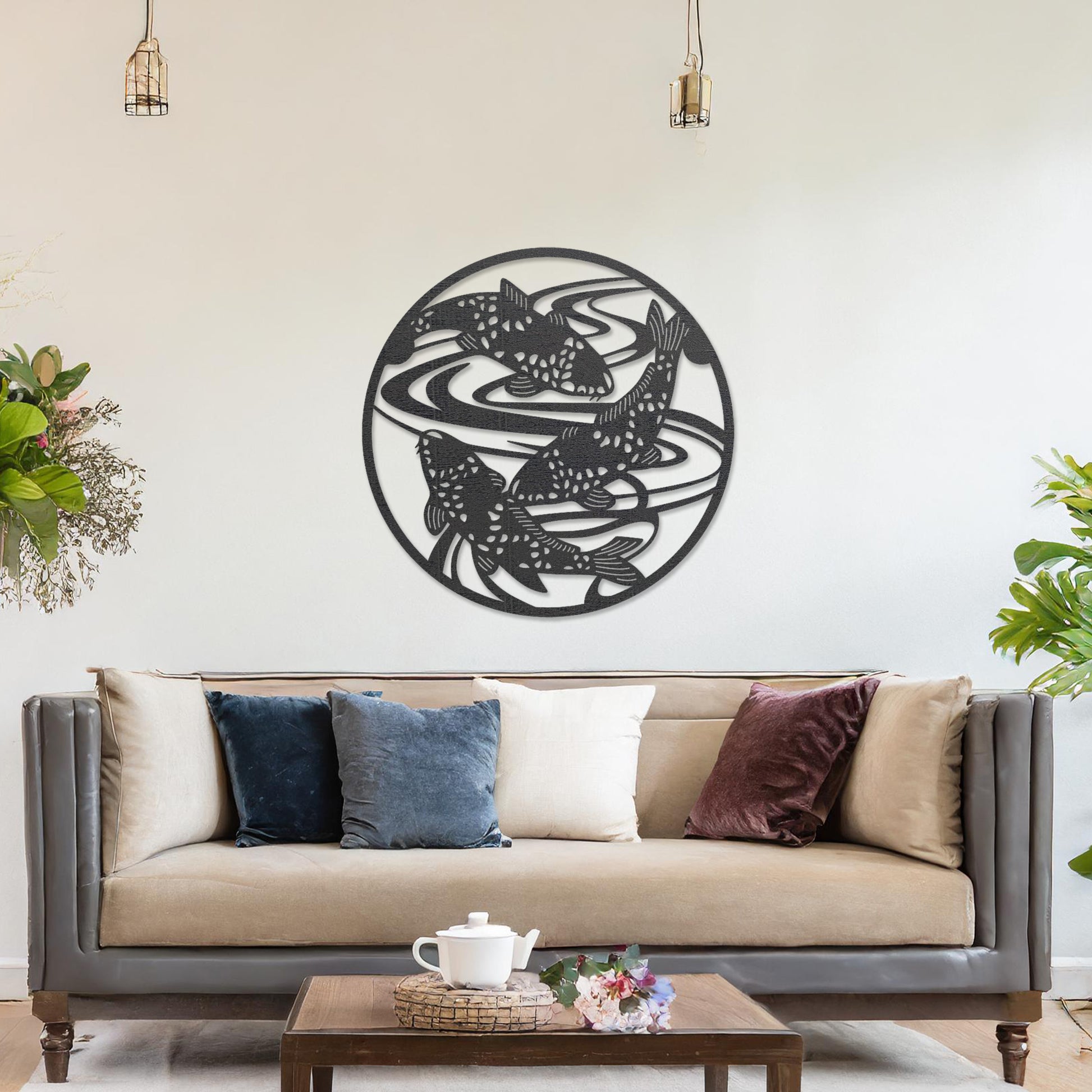 Wooden wall art design featuring koi fish swimming in circular patterns, framed in a round shape, placed on a neutral wall within modern room decor. The design evokes tranquility and movement with its elegant depiction of nature.