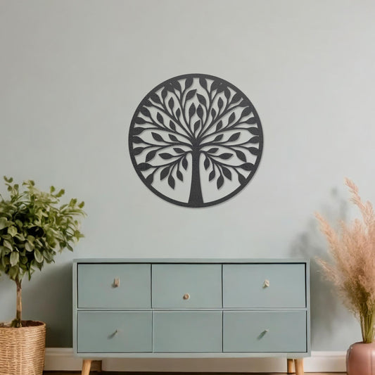 Wooden wall art featuring a circular tree design with stylised leaves and branches, displayed on a neutral wall within modern room decor, highlighting its elegant and nature-inspired craftsmanship.