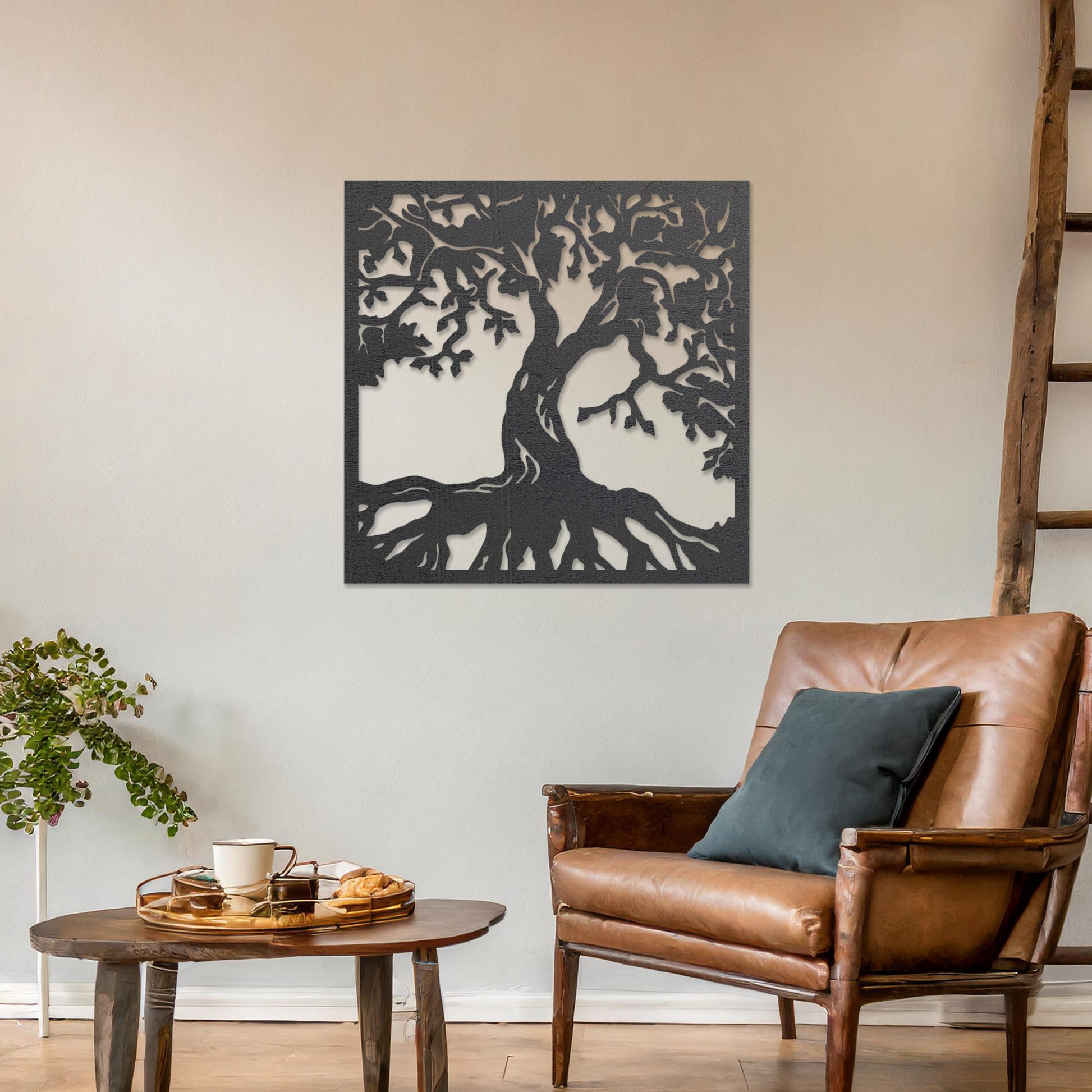 Wall art featuring a detailed tree of life design with sprawling branches and roots, symbolising growth and connection. The piece is displayed on a neutral wall within rustic-modern decor, adding a natural and meaningful focal point to the space.