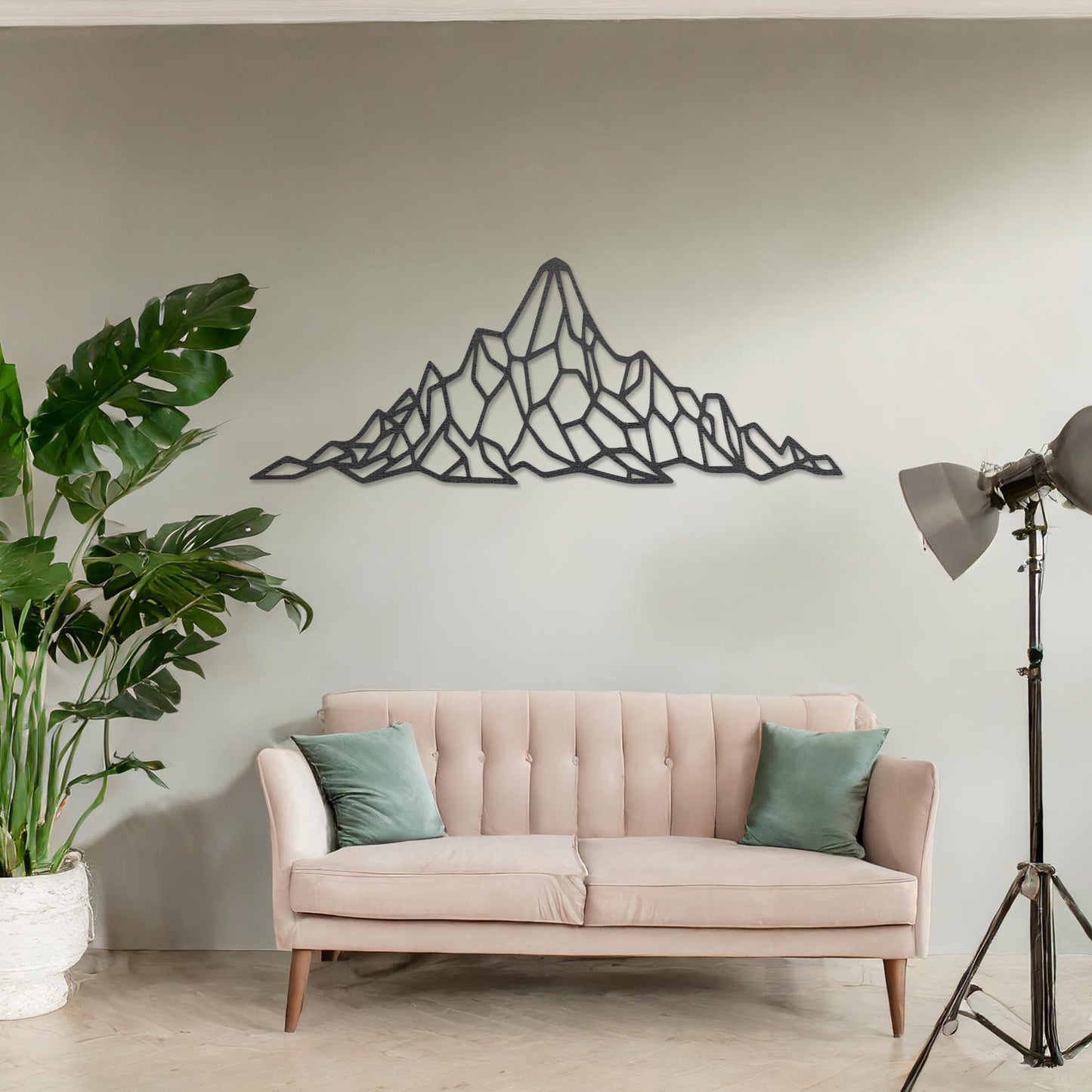 Wooden wall art featuring a geometric mountain range design with angular, interconnected shapes. The artwork is displayed on a neutral wall within modern room decor, emphasising its bold and minimalist aesthetic.