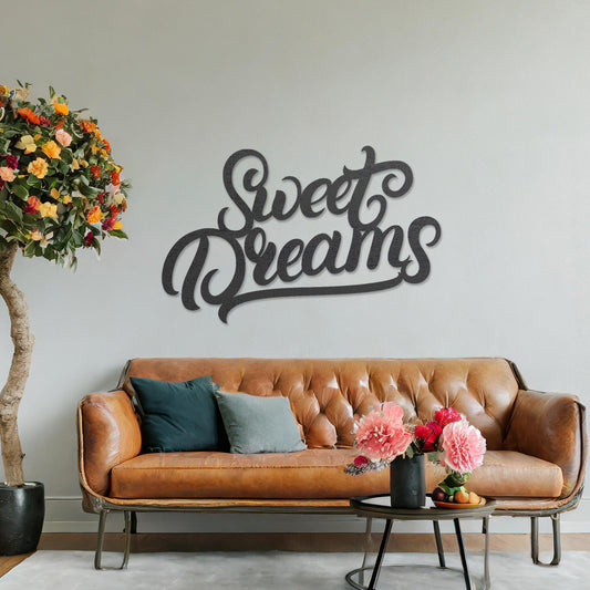 Wooden wall art featuring the phrase "Sweet Dreams" in elegant, cursive lettering. The artwork is displayed on a neutral wall within modern room decor, creating a cosy and inviting atmosphere.