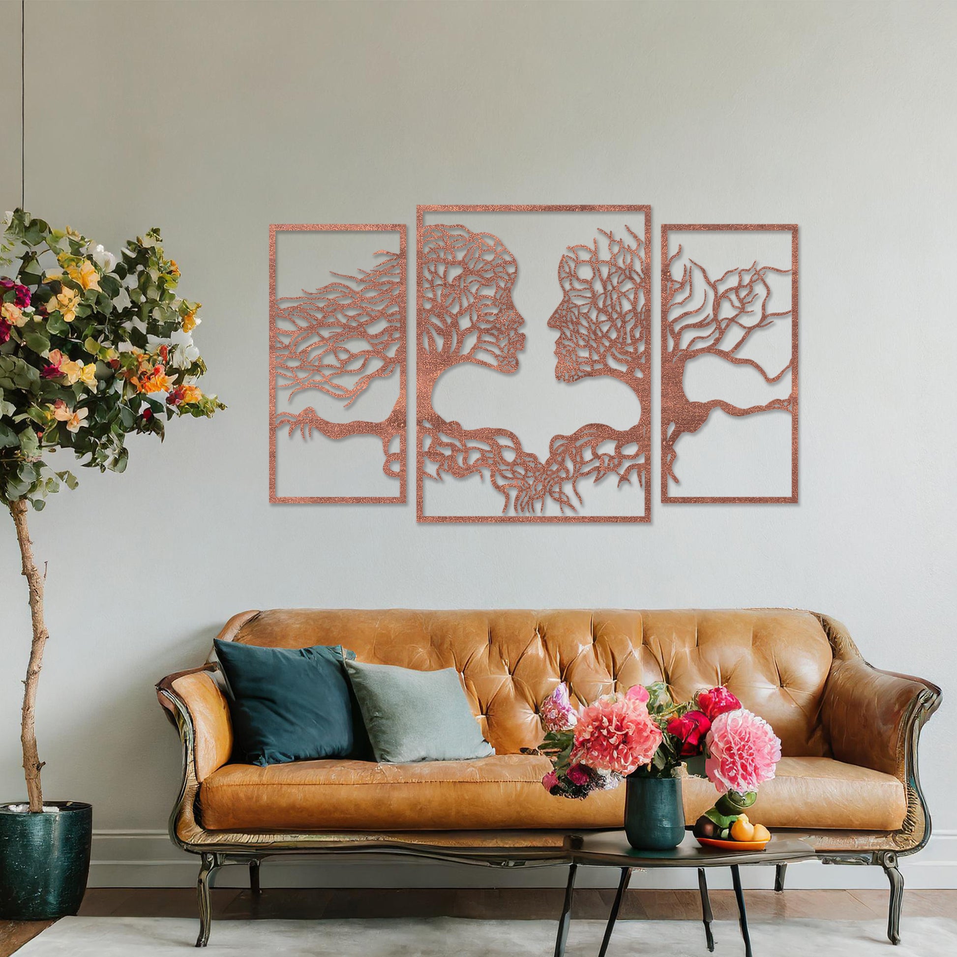 Wooden wall art showcasing a striking design of intertwined tree branches forming human profiles, placed on a neutral wall within modern room decor, highlighting its artistic and symbolic craftsmanship.