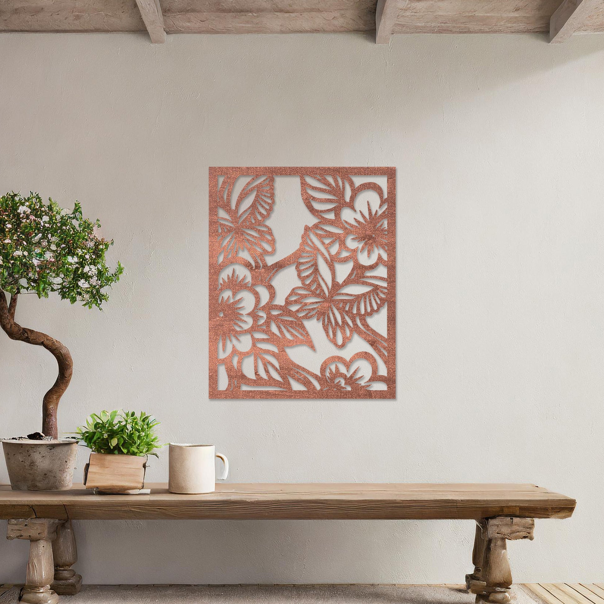 Wooden wall art featuring a square design with intricate floral and leaf patterns, showcasing a vibrant natural theme. The artwork is displayed on a neutral wall within modern room decor, highlighting its artistic and elegant appeal.