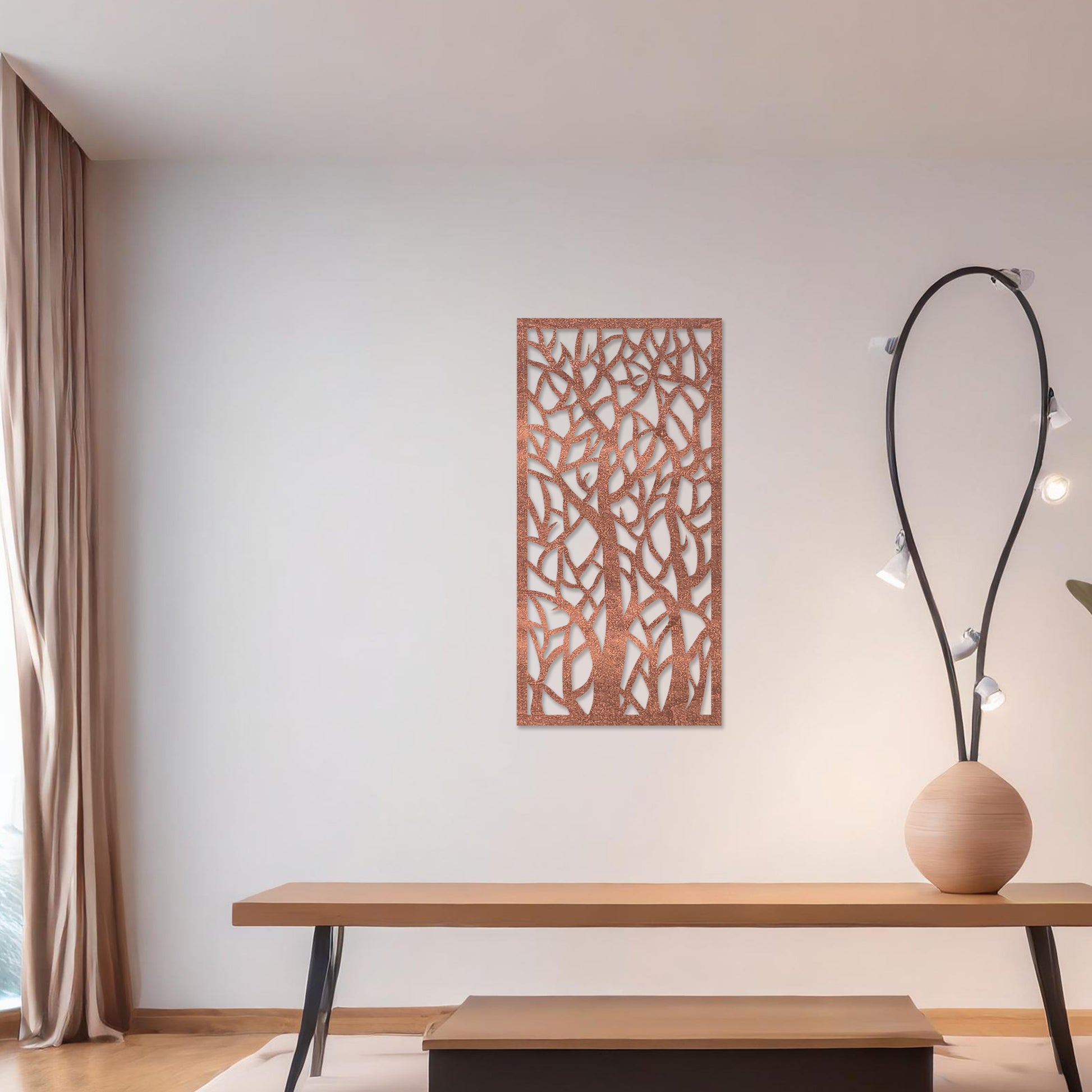 Wooden wall art featuring a vertical design of intertwined tree trunks and branches, displayed on a neutral wall within modern room decor, showcasing its intricate and artistic craftsmanship.