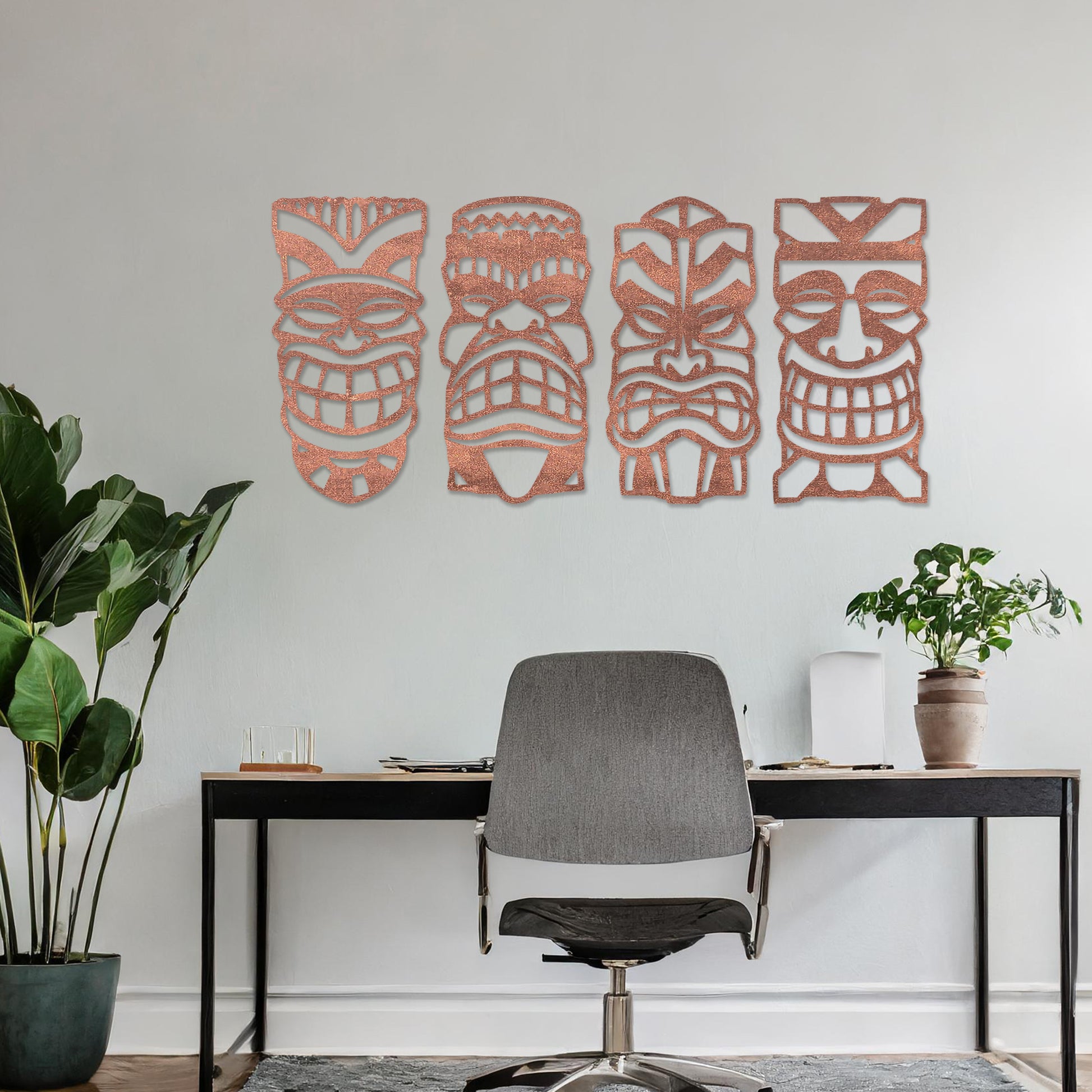 Wooden wall art design featuring four tribal masks arranged in a row on a neutral wall, set against modern room decor. The intricate design captures bold, expressive features and cultural motifs.