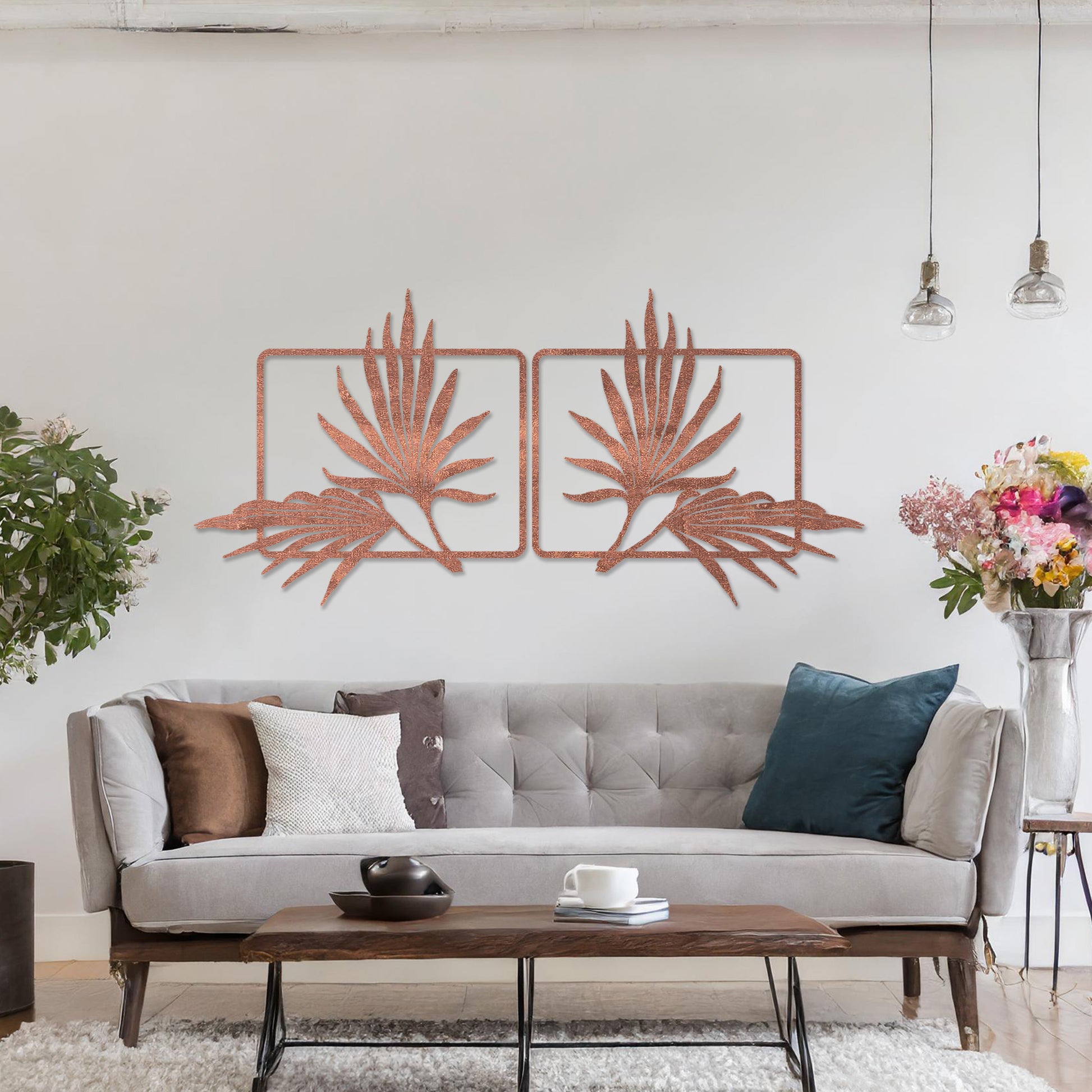 Wooden wall art featuring two symmetrical palm leaf designs within rectangular frames. The artwork is placed on a neutral wall in modern room decor, showcasing its elegant natural motif.