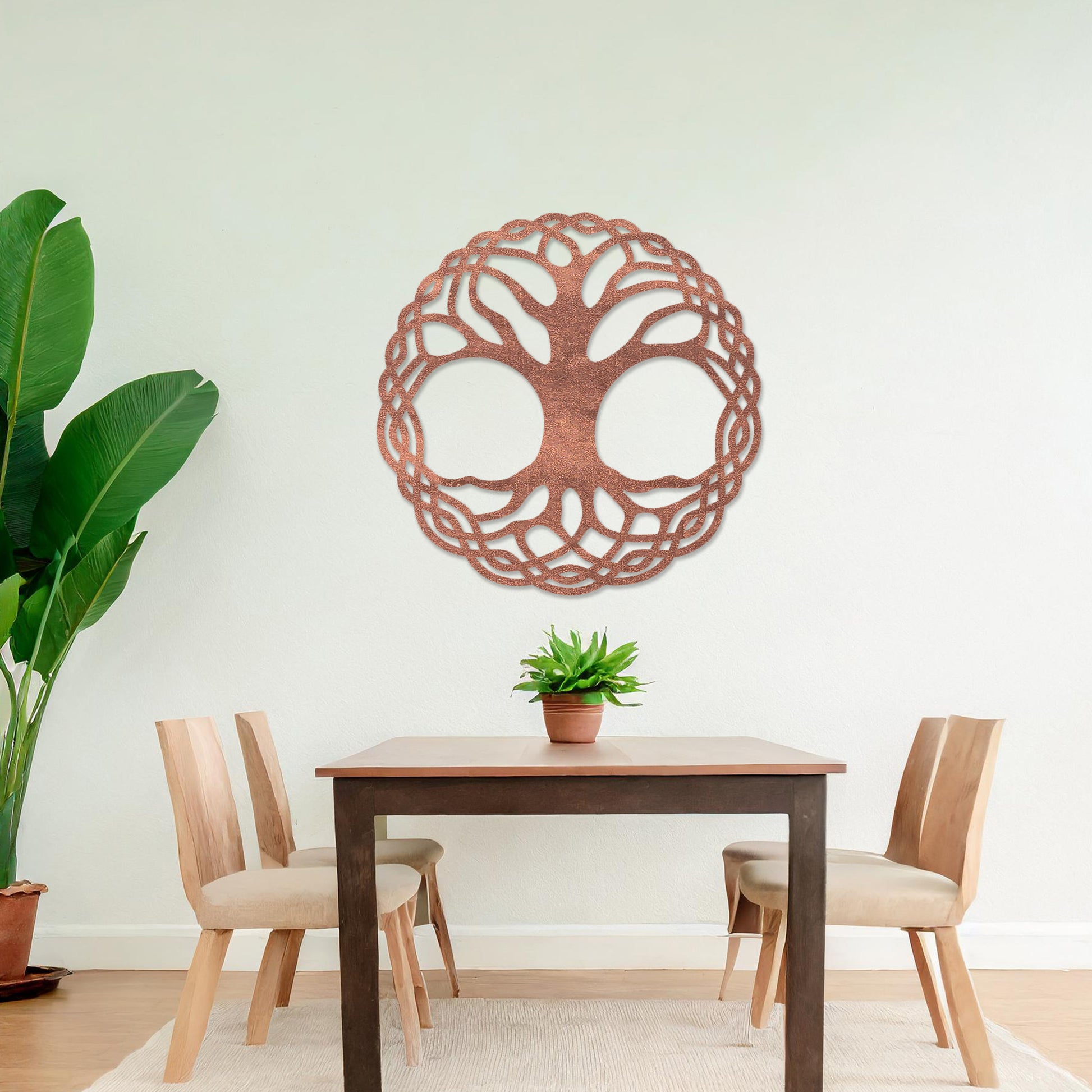 Wooden wall art depicting a circular tree of life design with intertwined roots and branches, placed on a neutral wall within a modern room decor, highlighting its intricate craftsmanship and symbolic aesthetic.