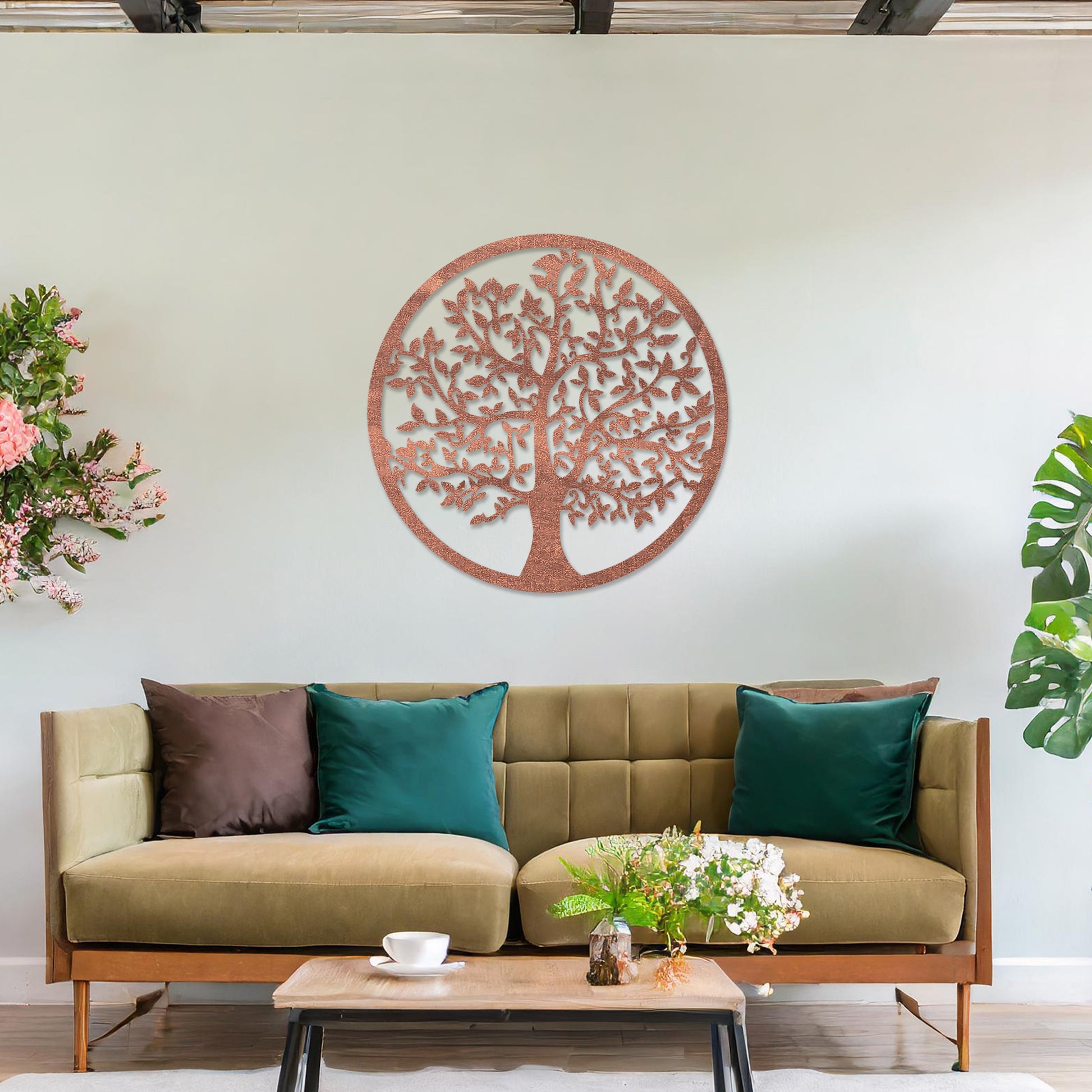 Wooden wall art featuring a circular design with an intricately detailed tree of life motif. The artwork is displayed on a neutral wall within modern room decor, highlighting its symbolic and artistic appeal.