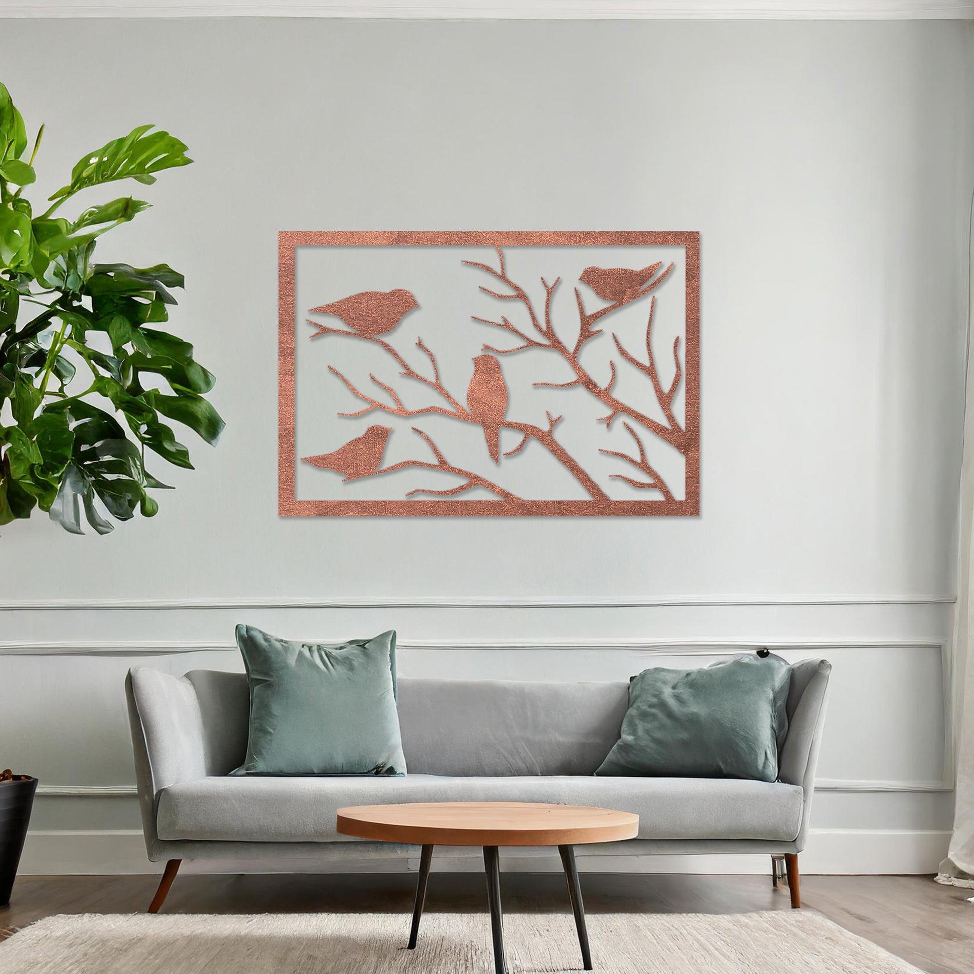 Wooden wall art featuring a rectangular design with birds perched on tree branches, displayed on a neutral wall within modern room decor, highlighting its elegant and nature-inspired craftsmanship.