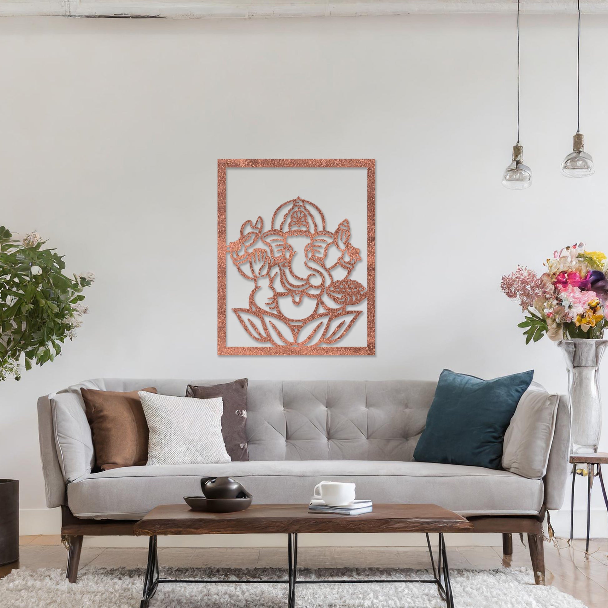 Wooden wall art featuring a framed design of Lord Ganesha sitting on a lotus flower with intricate details. The artwork is displayed on a neutral wall within modern room decor, highlighting its cultural and artistic elegance.