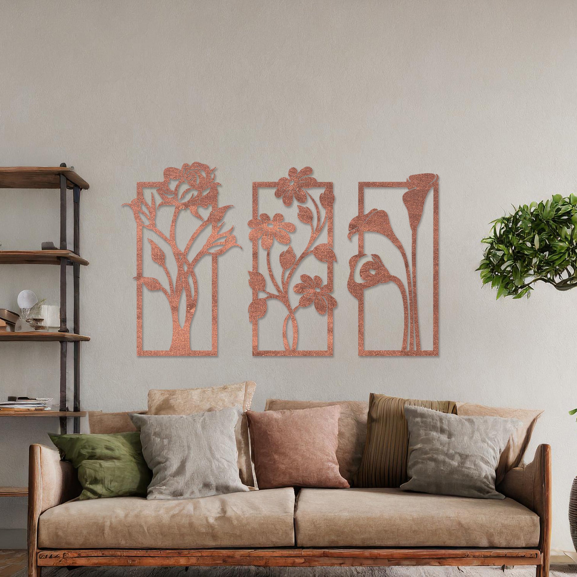 Wall art featuring a triptych of floral designs, each panel showcasing distinct flowers such as roses, daisies, and calla lilies. The artwork is displayed on a neutral wall within modern decor, adding a natural and elegant touch to the space.