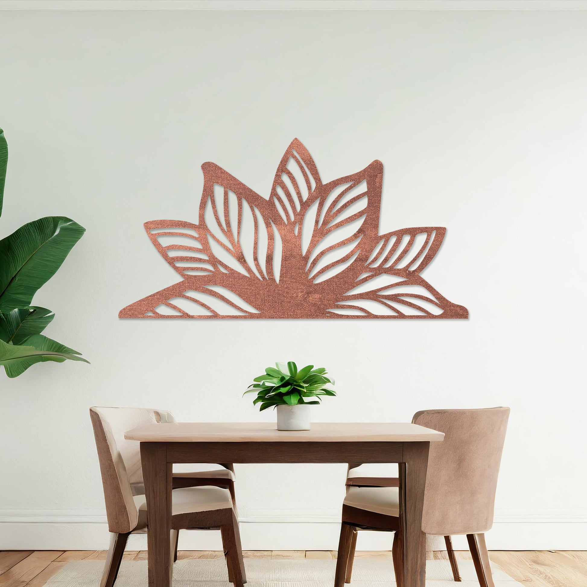 Wall art featuring a lotus-inspired design with layered leaves and intricate cut-out patterns. The piece is displayed on a neutral wall within modern decor, adding a natural and calming focal point to the space.